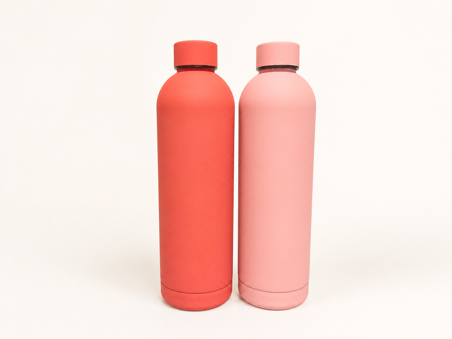Two fully visible slim bottles in red and pink